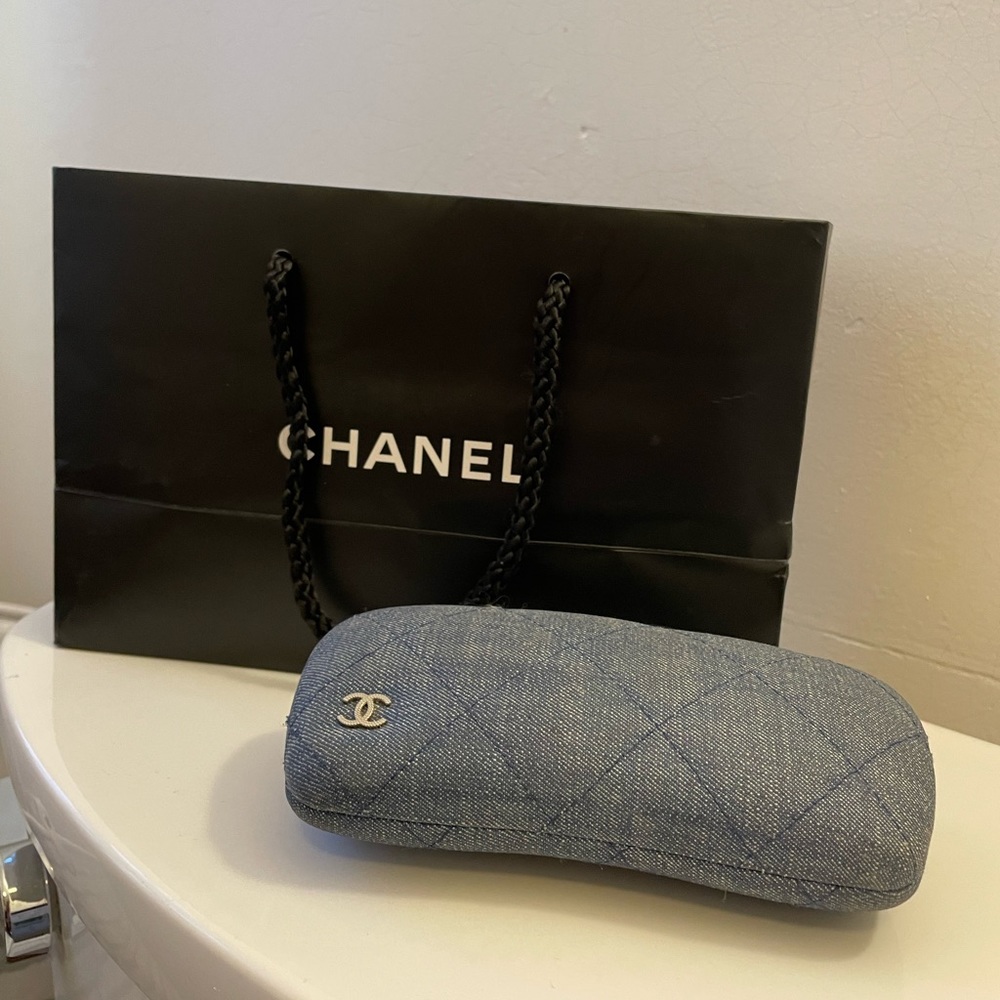 Chanel denim glass case with bag.  Unusual cover.  Perfect condition
